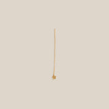 Gold necklace on a beige background