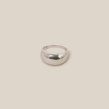 Silver ring on a beige background