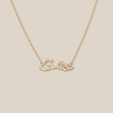 Gold necklace on a beige background