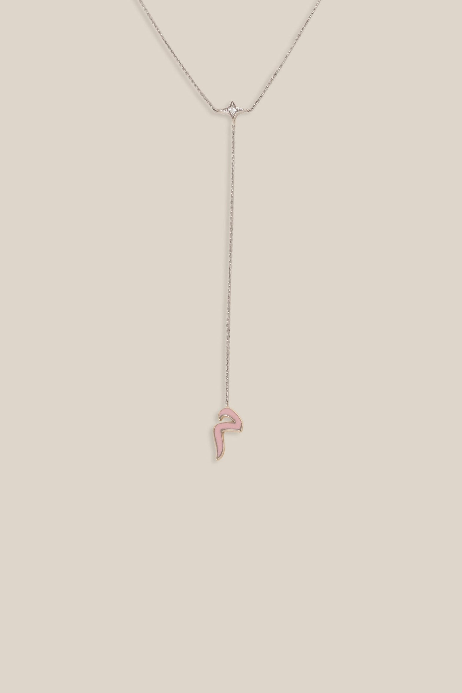 Thin necklace on a beige background