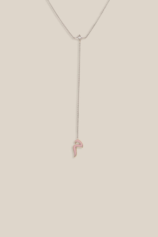 Thin necklace on a beige background